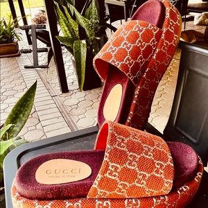 GG Platform Slides. Rich brown/orange fabric upper and GG silver logo.